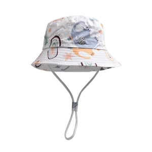 Detail of white kids sun hat with cartoon elephant patterns and adjustable chin strap