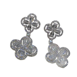 Elegant silver four-leaf clover drop earrings with micro-pave cubic zirconia crystals