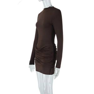 Detail view of the gathered ruched texture on the side of this brown long sleeve mini dress