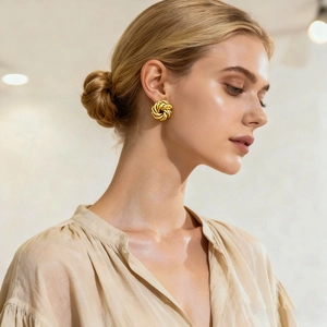 Elegant gold twisted swirl flower stud earrings for women with high polish metallic finish