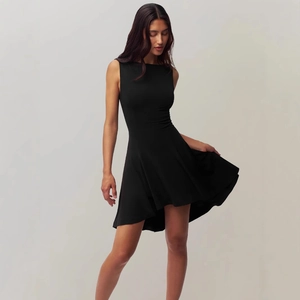 Elegant slim fit sleeveless black dress with A-line waist and flowing skirt silhouette