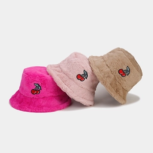 Plush winter bucket hats with cherry embroidery in magenta, pink and beige colors