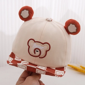 Detail of baby bear baseball cap showing 3D ears and checkerboard brim texture