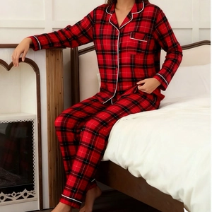 Detail view of red plaid pajamas set with notched lapel and soft fabric texture