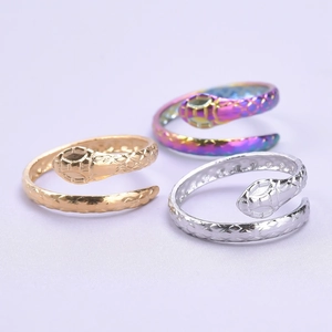 Detailed view of snake-shaped rings in gold, silver and rainbow finishes with scale texture