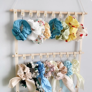 Double-tier wooden hair scrunchie organizer with faux leather straps and metal hooks