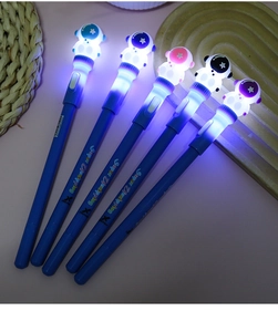 Detail of five LED astronaut spinning pens glowing with creative decompression design