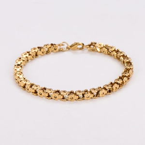 Elegant 18K gold plated stainless steel flower link bracelet on a white background