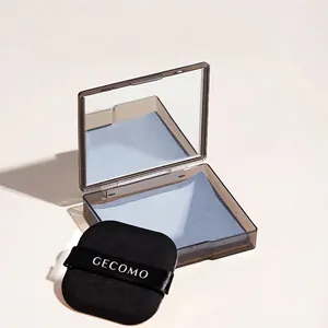 Portable bamboo charcoal oil absorbing sheets in a mirrored case with a square puff