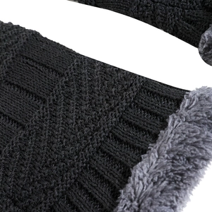 Winter knitted beanie with warm fleece lining and thick black wool texture for outdoor use