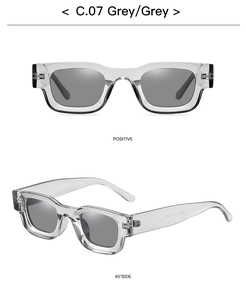 Macro view showing grey square frames and technical specs on the inner temple of sunglasses