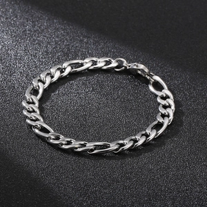 Polished silver stainless steel curb chain bracelet with lobster clasp on black background