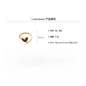 Detail view of 18k gold plated copper heart ring with red oil drip and zircon inlay