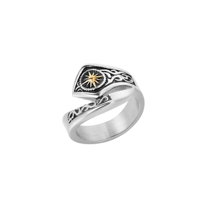 Macro detail of retro sunburst motif and carved shield design on titanium steel ring