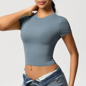 Close-up of light blue tight-fit yoga crop top made from breathable elastic fabric