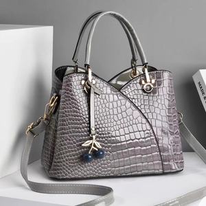 Gray crocodile embossed glossy tote bag with metal handles and cherry pendant charm