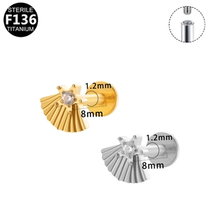 Macro detail of F136 titanium internally threaded heart labret studs in gold and silver