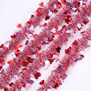 Pink heart-shaped tinsel garland with red and white sequins for Valentine party decoration