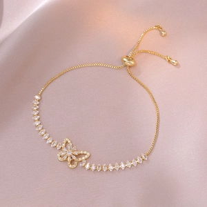 Adjustable gold butterfly bracelet with micro-pave zircons and flexible slider clasp