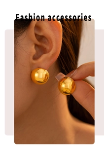 Detail of 18K gold plated half-round stud earring worn to show metallic luster