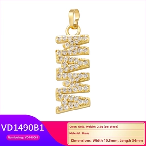 Detailed view of MAMA gold pendant in brass with sparkling cubic zirconia inlay