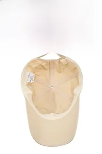Internal details of a khaki cotton sports cap featuring sweatband and adjustable strap