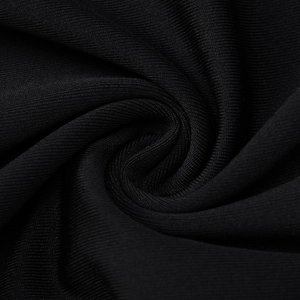 Dettaglio macro della trama del tessuto a costine nero elastico per completo aderente
