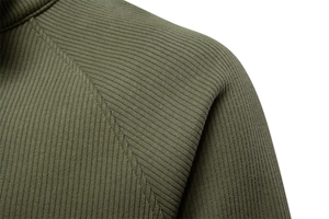 Macro detail of army green ribbed knit fabric and reinforced shoulder stitching