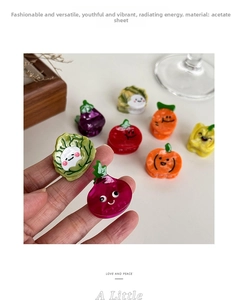 Detail of cute acetate hair clips in vegetable shapes with smooth glossy finish