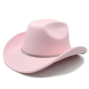 Detail of pink felt cowboy hat with sparkling rhinestone band on flat wide brim