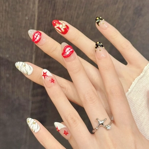 Pop Art style press-on nails with red lip 3D charms, star patterns, and gold stud accents