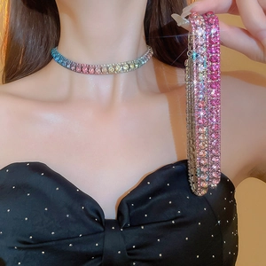 Macro shot of colorful rhinestone necklace and bracelet with rainbow gradient effect