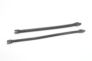 Detailed view of two black titanium steel woven link chains with metallic buckles