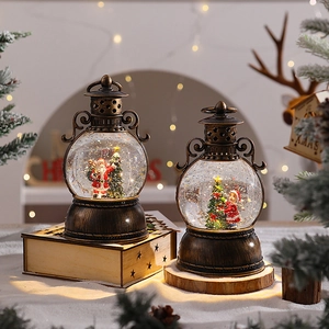 Detail of vintage bronze Christmas lanterns with snow globe scenes and warm glowing lights