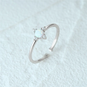 Macro detail of S925 silver adjustable ring with blue opal stone and white zircons