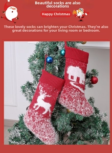 Detailed view of knitted Christmas stockings with reindeer and snowy cottage patterns