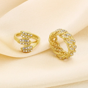 Luxury gold hollow leaf and chain ring set with sparkling white rhinestones on silk