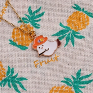 Christmas necklace with gold chain and white ghost pendant in orange wizard hat