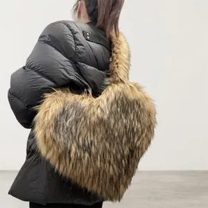 Detail view of heart-shaped faux raccoon fur crossbody bag with fluffy texture