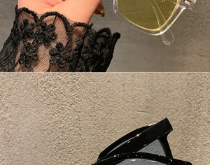 Detail showing vintage square sunglasses with transparent yellow and black blue frames