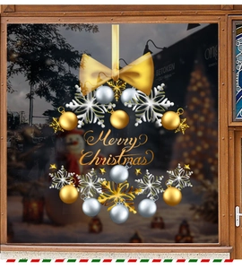 Detail of Christmas wreath static window sticker with gold snowflakes and bow on glass