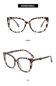 Macro view showing tortoise shell pattern and cat-eye frame structure of these glasses