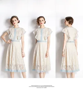 Detailed views showing the blue hollow lace trim on a white elegant midi dress