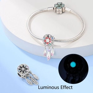 Luminous moon dreamcatcher charm on a silver snake chain bracelet with enamel details