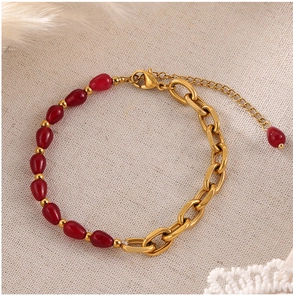 Detail of red agate stone and gold-plated chain bracelet with an adjustable clasp