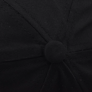 Close-up of black cotton twill baseball cap top button and reinforced seam stitching