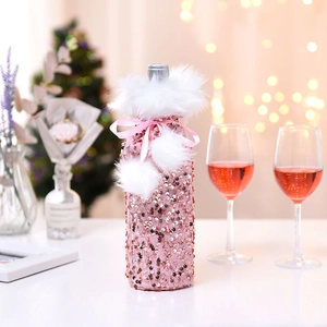 Pink sequin Christmas wine bottle cover with white fur trim and ribbon decoration