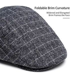 Winter plaid flat cap in dark grey wool featuring a foldable wide brim and padded lining