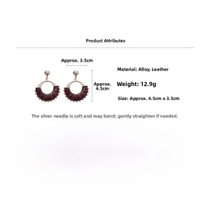 Detail view of retro leather wrapped round hoop earrings with silver needles and alloy