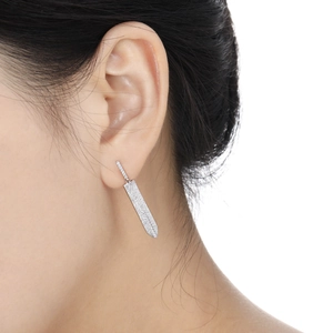 Sparkling S925 sterling silver sword earrings with pavé set zircon stones on female model